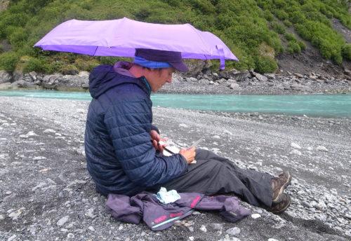 Instructor Kim McNett sketches in the rain